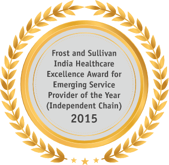 A gold medal with the words Frost and Sullivan India healthcare excellence award for the emerging service provider of the year.